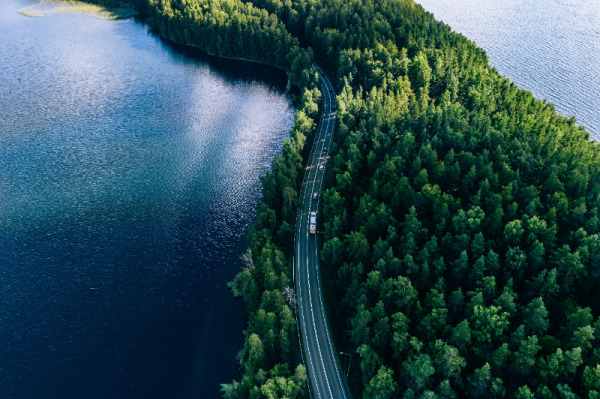 Ariel view of a scenic drive next to a lake
